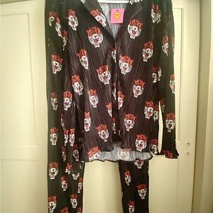 DRESSED IN LALA TIGER PLISSE shirt and pants.